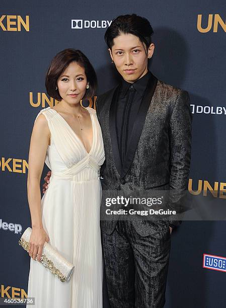 Actor Miyavi and Melody Ishihara arrive at the Los Angeles premiere of "Unbroken" at The Dolby Theatre on December 15, 2014 in Hollywood, California.