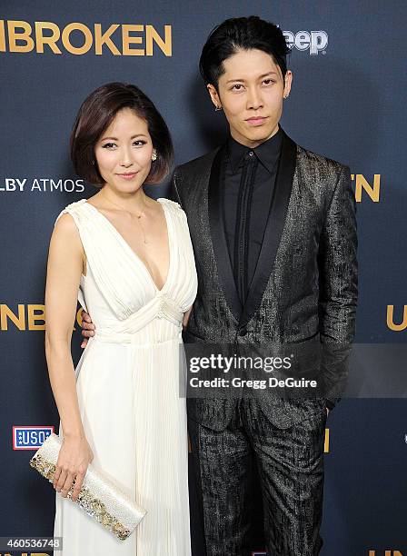 Actor Miyavi and Melody Ishihara arrive at the Los Angeles premiere of "Unbroken" at The Dolby Theatre on December 15, 2014 in Hollywood, California.