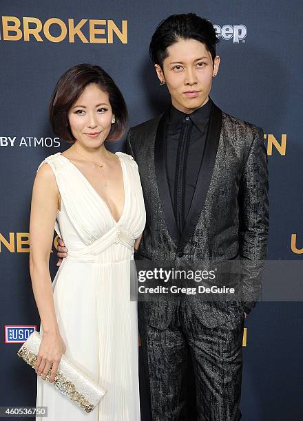 Actor Miyavi and Melody Ishihara arrive at the Los Angeles premiere of "Unbroken" at The Dolby Theatre on December 15, 2014 in Hollywood, California.