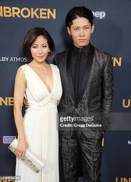 Actor Miyavi and Melody Ishihara arrive at the Los Angeles premiere of "Unbroken" at The Dolby Theatre on December 15, 2014 in Hollywood, California.