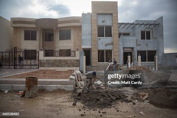 Construction continues on luxury villas inside Dream City, a new exclusive residential suburb that is being developed in Erbil on December 15, 2014...