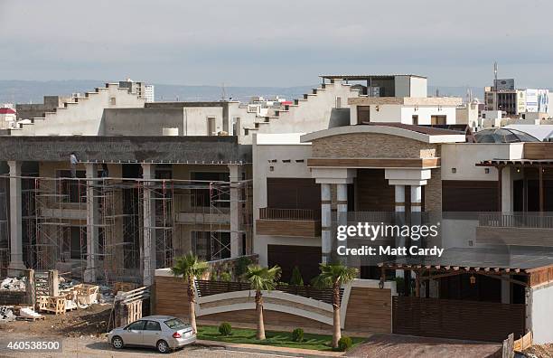 Construction continues on luxury properties inside Dream City, a new exclusive residential suburb that is being developed in Erbil on December 15,...