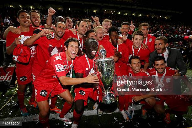 Adelaide players celebrate with the cup after winning the FFA Cup Final match between Adelaide United and Perth Glory at Coopers Stadium on December...
