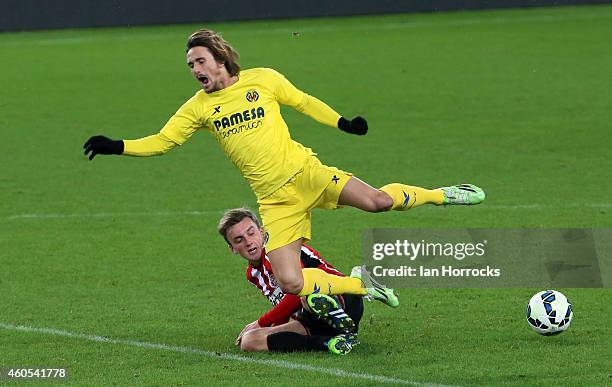 Aleix Garcia of Villarreal is brought down by Martin Smith of Sunderland during the Premier League International Cup match between Sunderland U21 and...