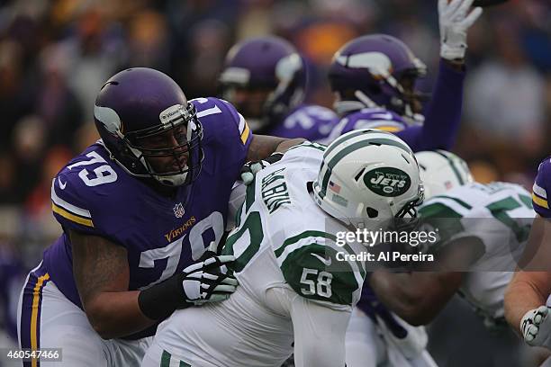 Offensive Tackle Mike Harris of the Minnesota Vikings blocks linebacker Jason Babin of the New York Jets at TCFBank Stadium on December 7, 2014 in...