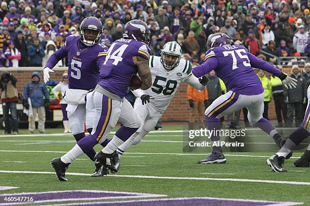 Linebacker Jason Babin of the New York Jets makes a stop against the Minnesota Vikings at TCFBank Stadium on December 7, 2014 in Minneapolis,...