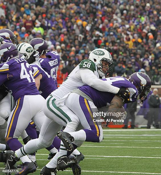 Linebacker Jason Babin of the New York Jets makes a stop against the Minnesota Vikings at TCFBank Stadium on December 7, 2014 in Minneapolis,...