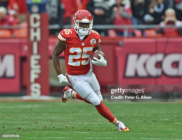 Running back Jamaal Charles of the Kansas City Chiefs runs with the ball against the Oakland Raiders during the first half on December 14, 2014 at...