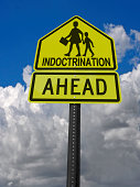 indoctrination ahead warning roadsign