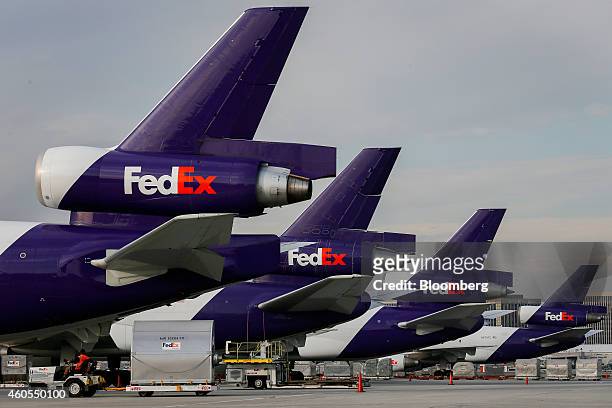 FedEx Corp. Cargo planes sit on the tarmac at the company's distribution hub at Los Angeles International Airport in Los Angeles, California, U.S.,...