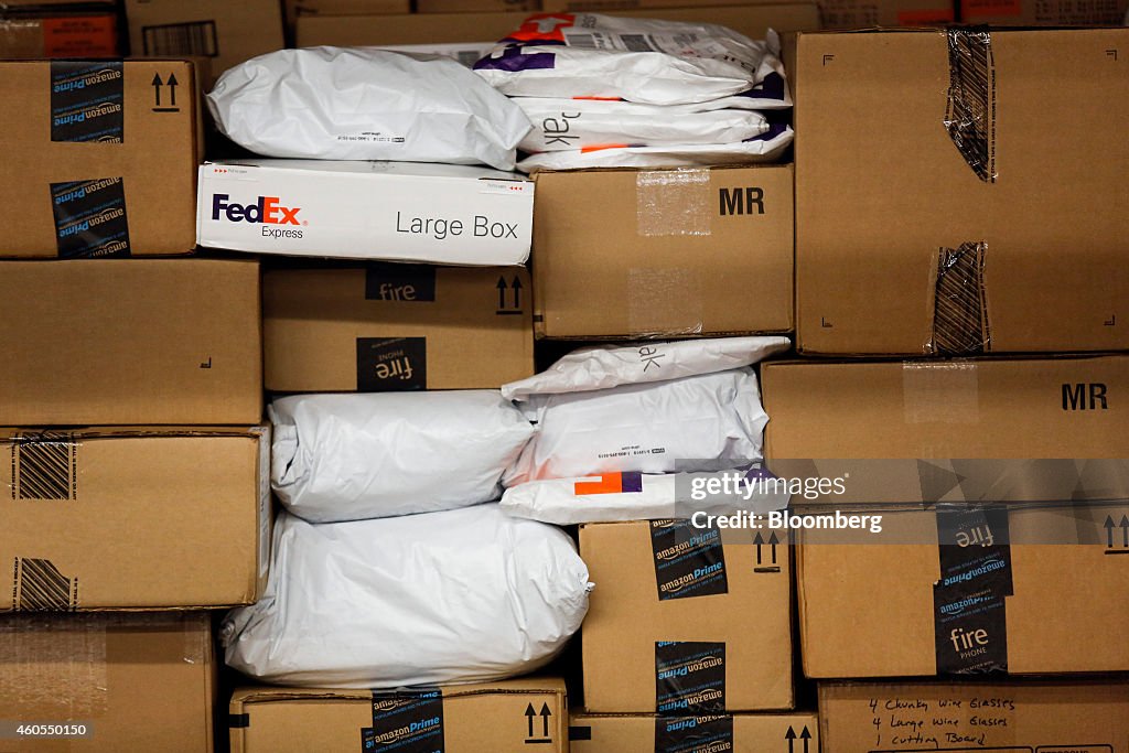 Time Box Container Fedex Packages sit stacked in a shipping container inside the FedEx Corp ...