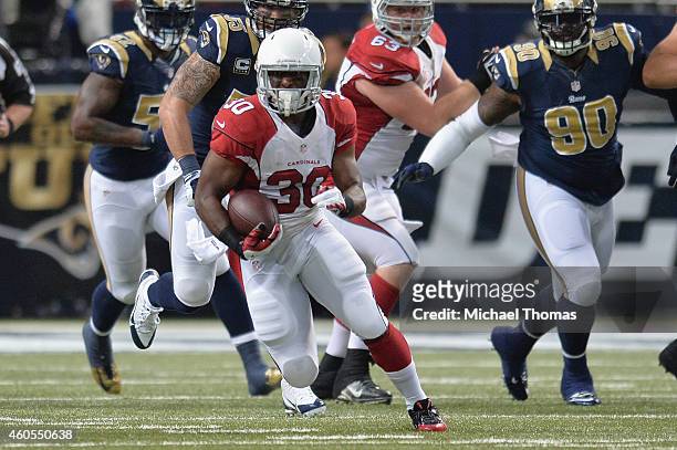 Stepfan Taylor of the Arizona Cardinals rushes against the St. Louis Rams at the Edward Jones Dome on December 11, 2014 in St. Louis, Missouri.