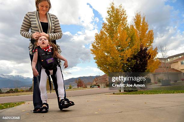 October 22, - Janéa Cox uses special equipment that lets her walk with her daughter. Haleigh is 5 years old and has never taken a normal step with...