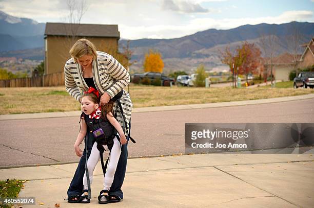 October 22, - A walking machine helps Haleigh walk with her mom, Janéa Cox. The equipment helps Haleigh stretch and use muscles the are mostly...