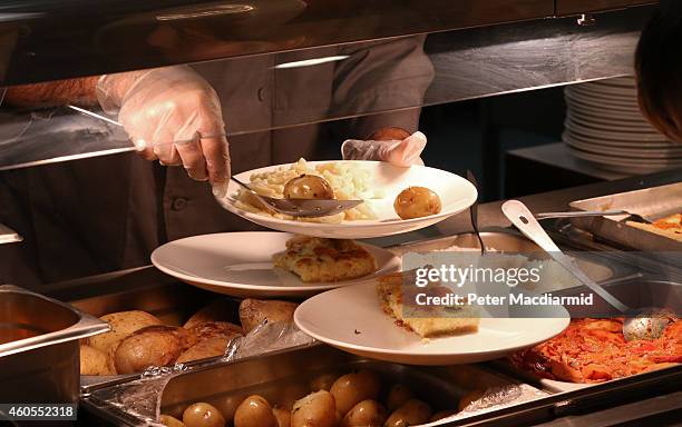 Lunch is served to students at a secondary school on December 1, 2014 in London, England. Education funding is expected to be an issue in the general...