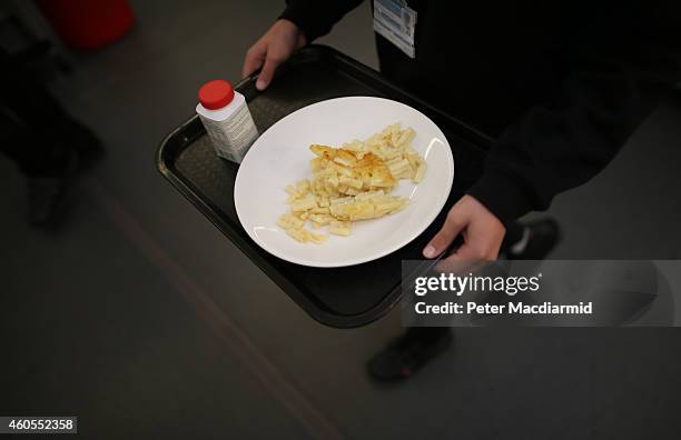 Student carries his lunch at a secondary school on December 1, 2014 in London, England. Education funding is expected to be an issue in the general...