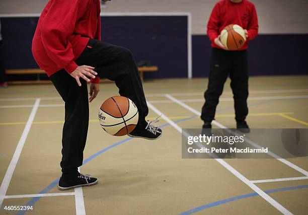 Boys play basketball in the sports hall at a secondary school on December 1, 2014 in London, England. Education funding is expected to be an issue in...