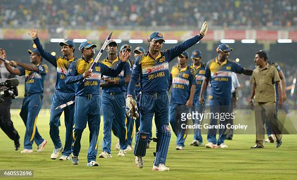 Mahela Jayawardena and Kumar Sangakkara of Sri Lanka wave the crowd after winning the 7th One Day International match between Sri Lanka and England...