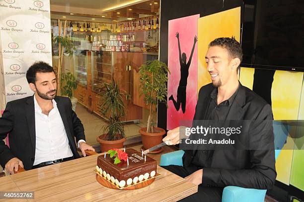 The worlds tallest man Sultan Kosen who holds the Guinness World Record for tallest living male at 2.51 m , celebrates his 32nd birthday at the cafe...