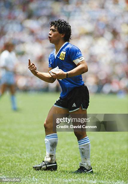 Diego Maradona of Argentina reacts whilst carrying a water bag during the FIFA 1986 World Cup match between Argentina and England at the Azteca...