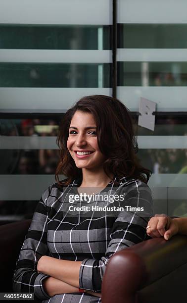 Bollywood actor Anushka Sharma poses for a picture during a visit to HT office for the promotion of her upcoming film PK on December 12, 2014 in...