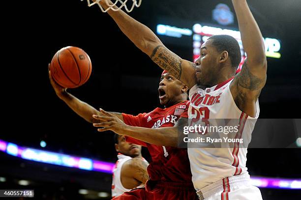 Deverell Biggs of the Nebraska Cornhuskers goes up for a layup while being defended by Amir Williams of the Ohio State Buckeyes during the first half...