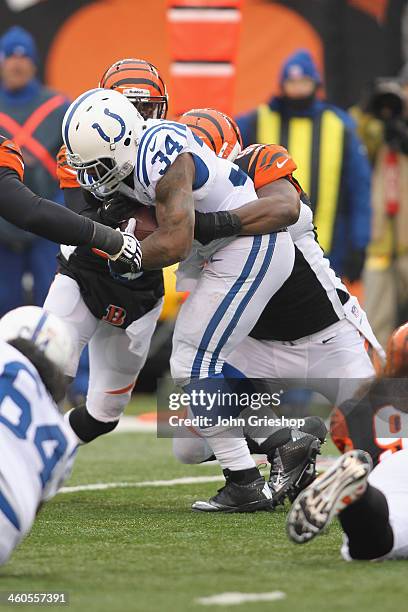 Trent Richardson of the Indianapolis Colts runs the ball upfield during the game against the Cincinnati Bengals at Paul Brown Stadium on December 8,...