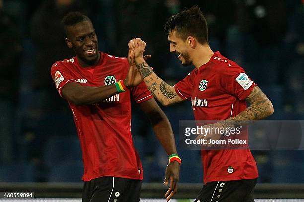 Joselu of Hannover celebrates with his team mate Salif Sane after scoring his team's second goal during the Bundesliga match between Hannover 96 and...