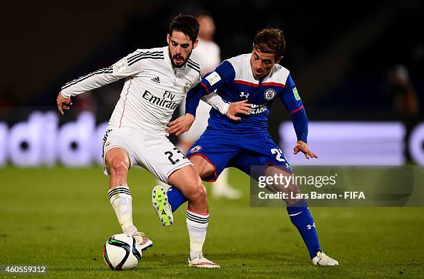 Isco of Real Madrid is challenged by Hernan Bernardello of Cruz Azul during the FIFA Club World Cup Semi Final match between Cruz Azul and Real...