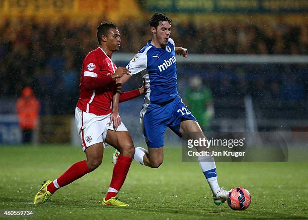 Ben Heneghan of Chester battles with Mason Holgate of Barnsley during the FA Cup Second Round Replay match between Chester City and Barnsley at Deva...