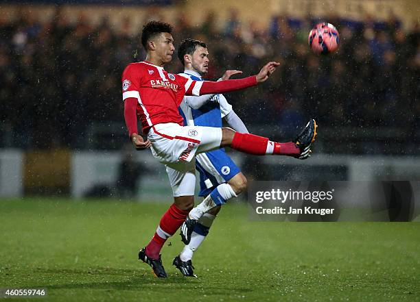 Mason Holgate of Barnsley clears the ball from Craig Mahon of Chester during the FA Cup Second Round Replay match between Chester City and Barnsley...