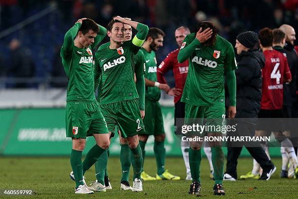 Augsburg's midfielder Erik Thommy, Dutch defender Paul Verhaegh, midfielder Alexander Esswein and Korean defender Jeong-Ho Hong react after the...
