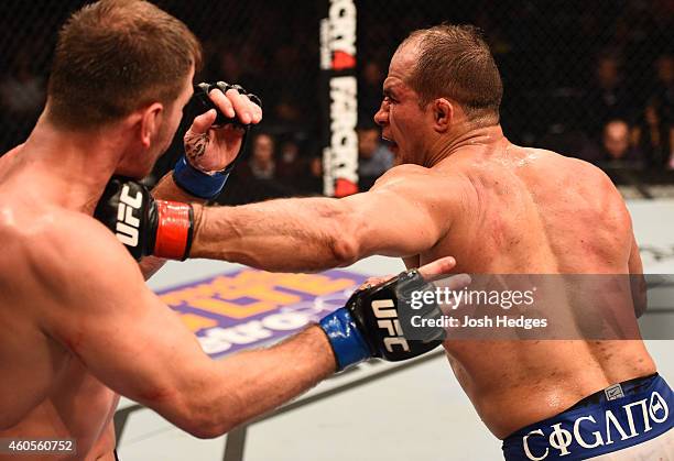 Junior Dos Santos of Brazil punches Stipe Miocic in their heavyweight fight during the UFC Fight Night event at the U.S. Airways Center on December...
