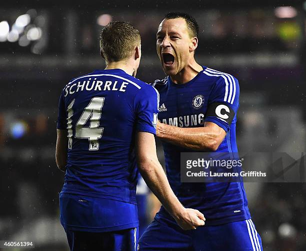 Andre Schurrle of Chelsea celebrates his goal with John Terry of Chelsea during the Capital One Cup Quarter-Final match between Derby County and...
