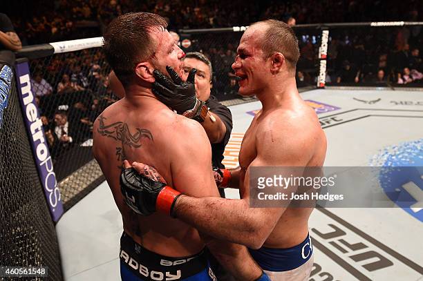 Junior Dos Santos of Brazil congratulates Stipe Miocic after their heavyweight fight during the UFC Fight Night event at the U.S. Airways Center on...