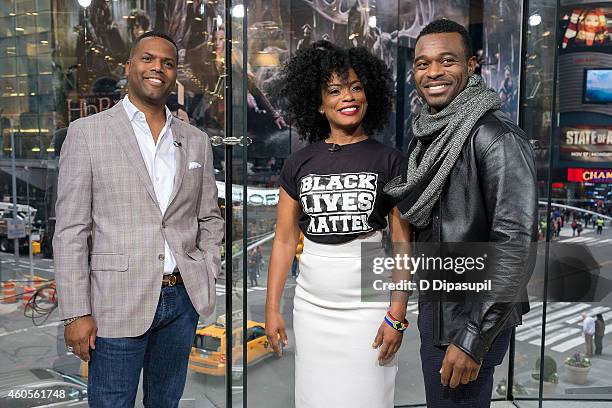 Calloway interviews Aunjanue Ellis and Lyriq Bent during their visit to 'Extra' at their New York studios at H&M in Times Square on December 16, 2014...