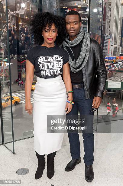 Aunjanue Ellis and Lyriq Bent visit 'Extra' at their New York studios at H&M in Times Square on December 16, 2014 in New York City.