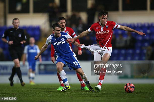 Paul Digby of Barnsley battles with Sean McConville of Chester during the FA Cup Second Round Replay match between Chester City and Barnsley at Deva...