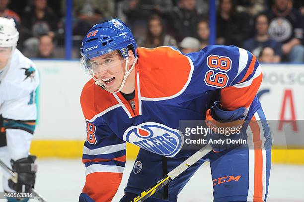Tyler Pitlick of the Edmonton Oilers lines up for a face off during the game against the San Jose Sharks on December 7, 2014 at Rexall Place in...