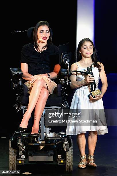 Flavia Saraiva poses with the Fan's Choice trophy as Lais Souza looks on during the Brazil Olympics Awards Ceremony at Theatro Municipal on December...