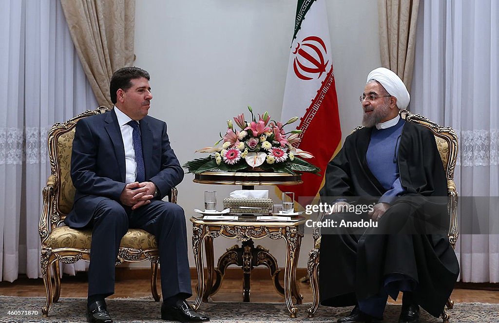 Syrian PM al-Halqi meets Iranian President Rouhani