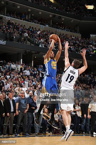 Shaun Livingston of the Golden State Warriors shoots against Patrick Christopher of the Utah Jazz on December 16, 2014 at the FedExForum in Memphis,...