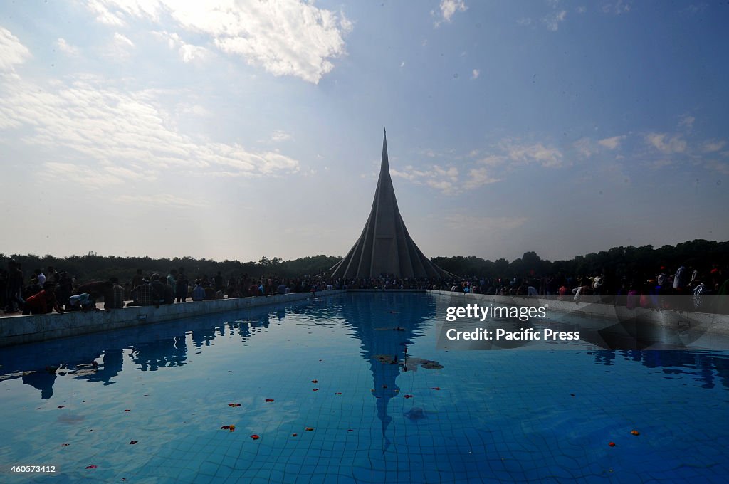 People lay flowers to  the National Memorial in Savar during...