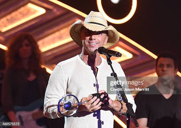 Honoree Kenny Chesney accepts the Groundbreaker Award onstage during the 2014 American Country Countdown Awards at Music City Center on December 15,...