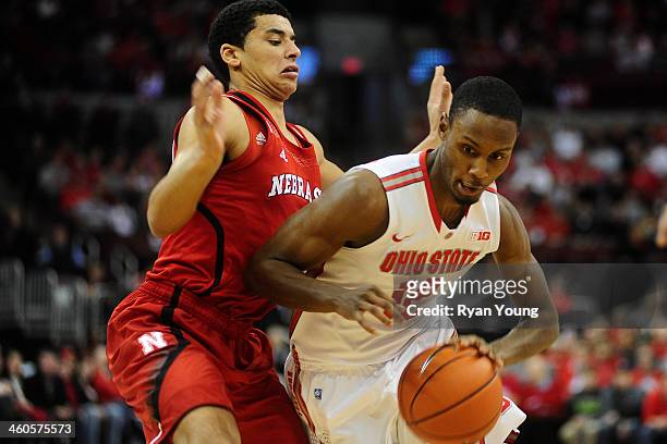Sam Thompson of the Ohio State Buckeyes dribbles past Benny Parker of the Nebraska Cornhuskers on January 4, 20114 at Value City Arena in Columbus,...