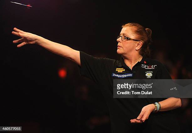 Rachel Brooks of England in action against Ann Louise Peters of Denmark on day one of the BDO Lakeside World Professional Darts Championships at...