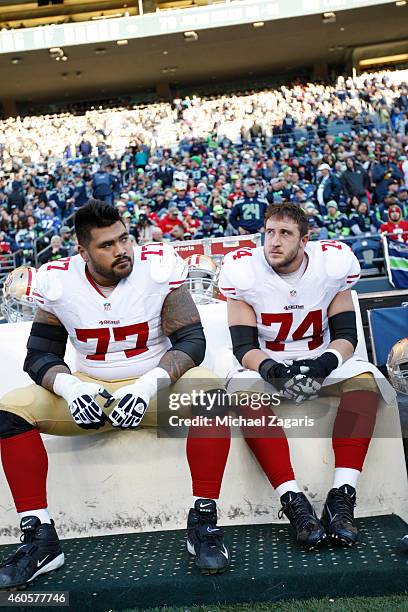 Mike Iupati and Joe Staley of the San Francisco 49ers sits on the bench during the game against the Seattle Seahawks at CenturyLink Field on December...