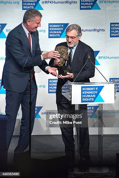 New York Mayor Bill de Blasio presents actor Robert De Niro with his award during the 2014 Robert F. Kennedy Ripple Of Hope Awards at the New York...