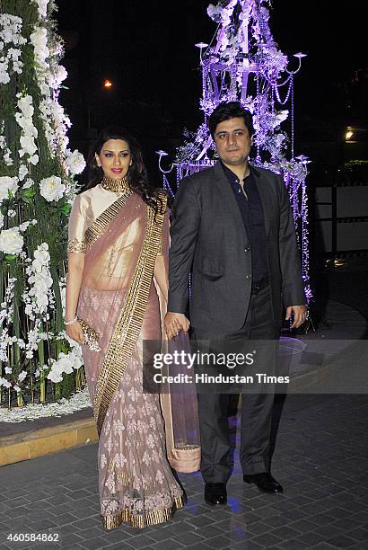 Bollywood actor Sonali Bendre with her husband Goldie Behl during sangeet ceremony of Riddhi Malhotra and Tejas Talwalkar on December 13, 2014 in...