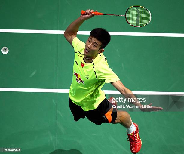 Chen Long of China plays a smash against Kenichi Tago of Japan during the Men's Singles match on day one of the BWF Destination Dubai World...